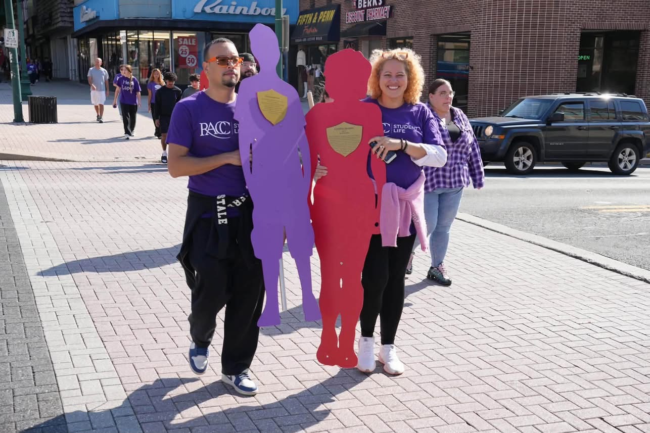 Jaime walking with community members at a Safe Berks event